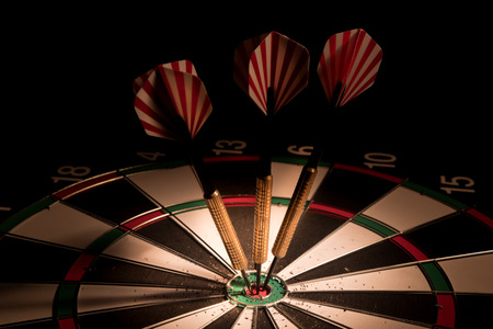 darts arrows in the target centerの写真素材