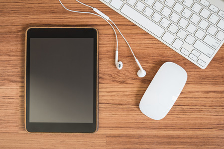 Topview of electronic devices on wooden floorの写真素材