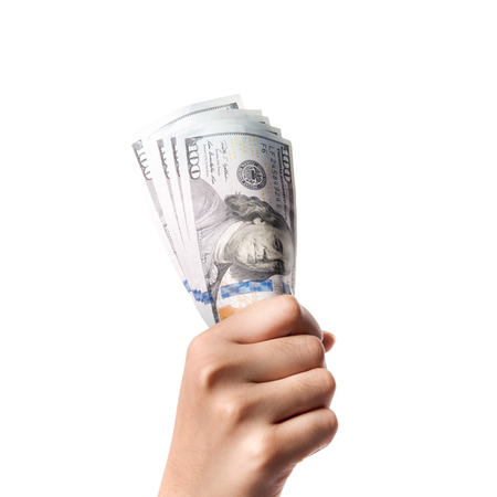 Business and Financial concept, cash or money, one hundred dollar banknotes in woman hand on isolated white backgroundの写真素材