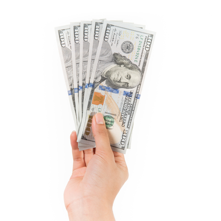 Business and Financial concept, cash or money, one hundred dollar banknotes in woman hand on isolated white backgroundの写真素材