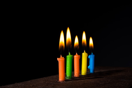 Multi color candlt burn in the darkの写真素材