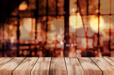 Empty top of wooden table or counter on cafeteria, bar, coffeeshop background. For product displayの写真素材