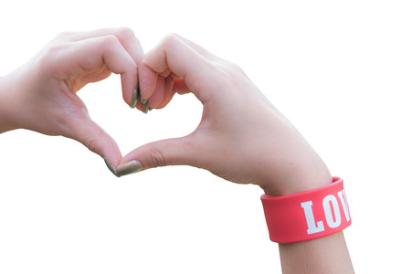 Female hands in form of heart isolated on whiteの写真素材
