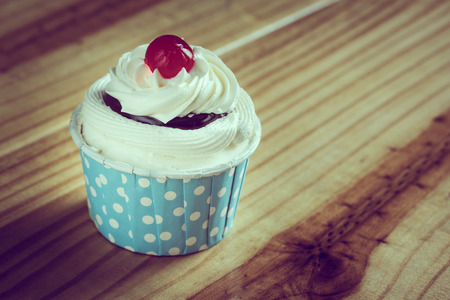 cup cake in pokadot white on light blue cup, vintage styleの写真素材