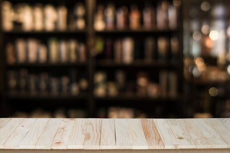 Empty top of wooden table or counter on cafeteria, bar, coffeeshop background. For product displayの写真素材