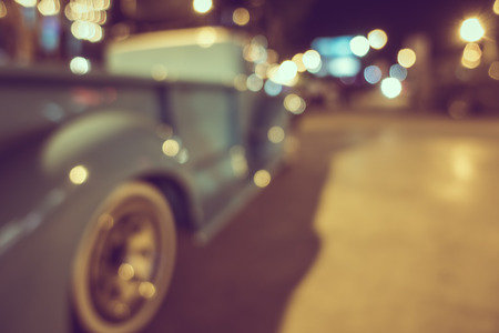Retro truck at parking lot with bokeh light, vintage effectの写真素材