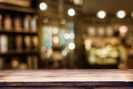 blurred background of bar and dark brown desk space of retro woodの写真素材
