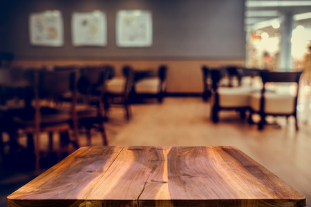 blurred background of bar and dark brown desk space of retro woodの写真素材