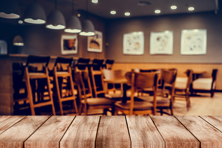 blurred background of bar and dark brown desk space of retro woodの写真素材