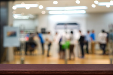 Empty top of wooden table or counter on cafeteria, bar, coffeeshop background. For product displayの写真素材