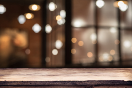 blurred background of bar and dark brown desk space of retro woodの写真素材