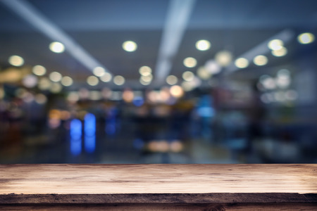 blurred background of bar and dark brown desk space of retro woodの写真素材