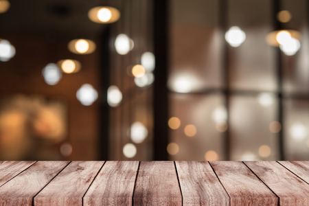 blurred background of bar and dark brown desk space of retro woodの写真素材
