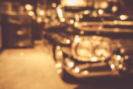 defocus or blur image of retro car and motorcycle, effect by vintage styleの写真素材