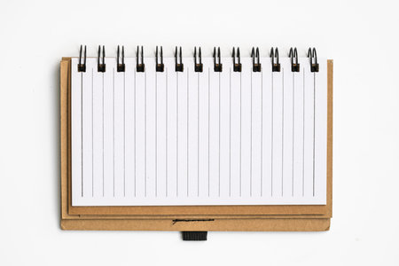 blank notebook on white table background