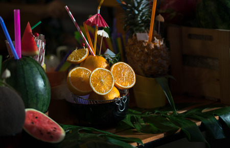 Local orange juice on wooden table with watermelon juice and pineapple juiceの写真素材