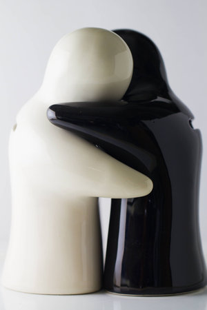 Couple ceramic hugの写真素材