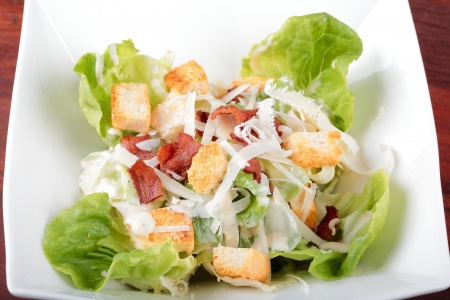 Vegetable salad with salman ,tometo , bread on white plate.の写真素材