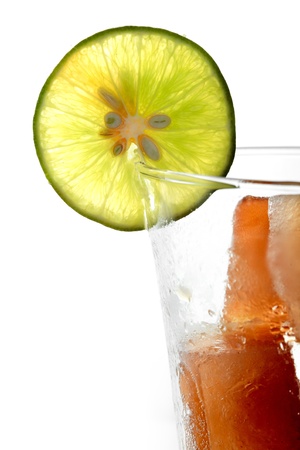 A glass of colorful punch with ice on isolate background.の写真素材