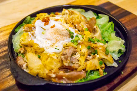 Delicious fried egg stuff with hot panの写真素材