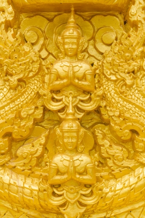 Golden buddha statue in Thai temple の写真素材