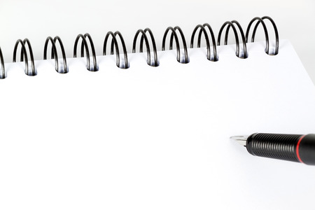 White paper and black penの写真素材