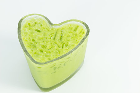 Ice green tea in heart shaped glassの写真素材