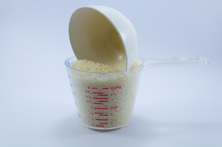 Thailand rice is in the cup for measuring.の写真素材