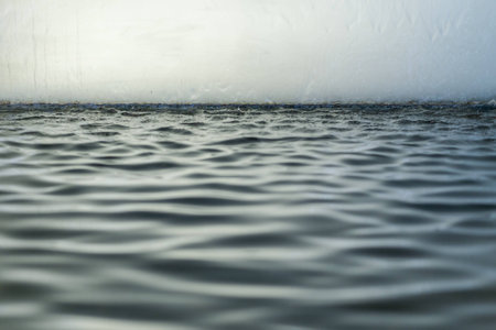 Drama ripple with glassの写真素材