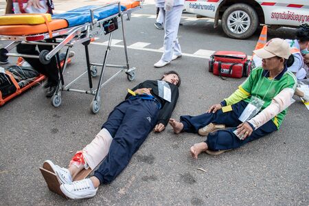 PHANA, AMNAT CHAROEN, THAILAND. - on April 3 , 2018 - The incident occurred during the Songkran festival. In the event, The injured people are lying waiting for resuscitation officer delivered the hospital.のeditorial素材