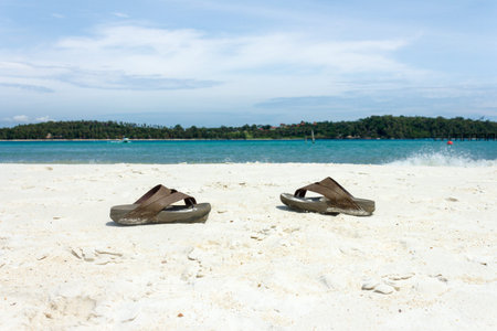 slippers on the beach