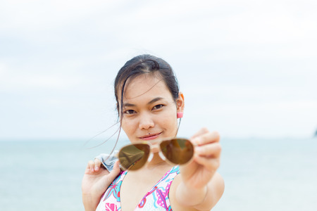 A girl happy at the beachの写真素材