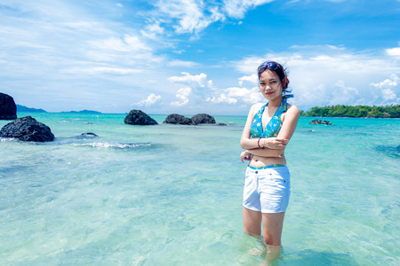 A girl happy at the beachの写真素材