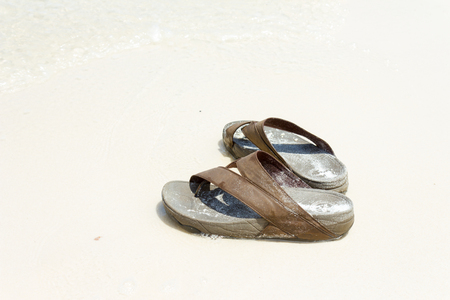 slippers on the beachの写真素材