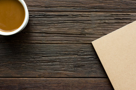 coffee and book  on wooden table in relax time