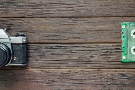 vintage camera and tape cassette on wooden backgroundの写真素材