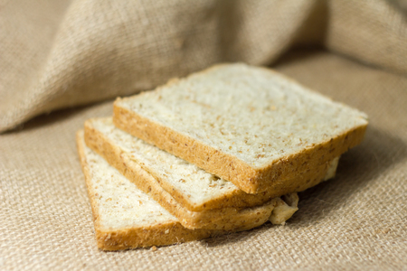 whole wheat bread  on the sack backgroundの写真素材