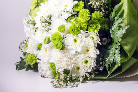 close up of chrysanthemum flower with bouquet on white backgroundの写真素材