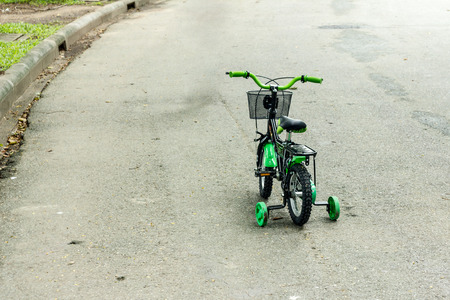 kid bike on road in a parkの写真素材