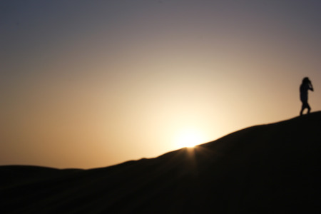 abstract of silhouette mountain in the desert in sunset, out of focusの写真素材