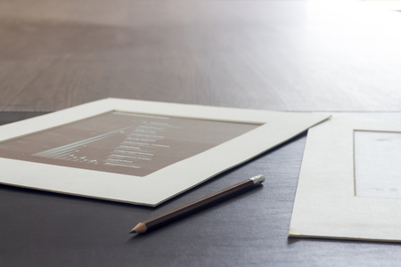 charts and pencil on table in morning work timeの写真素材