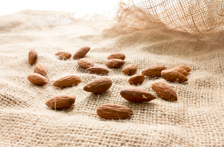 almond seed on brown sack  background textureの写真素材
