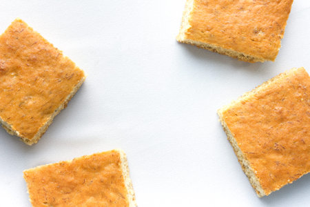 banana cake square shape on white cloth background texture take photo top view have copy space