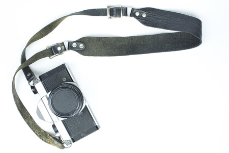vintage camera with strap on white background, top viewの写真素材