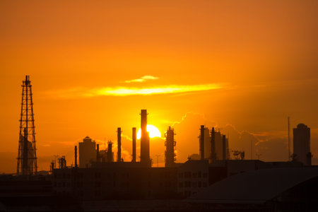 oil refinery silhouette with twilight sunset sky