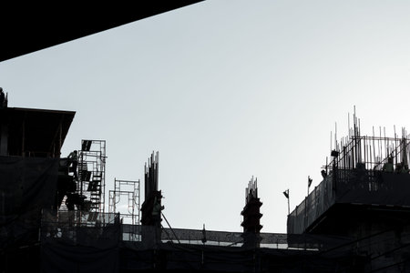 silhouette of construction work in high building