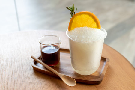 beverages flavor orange with ice on wooden table