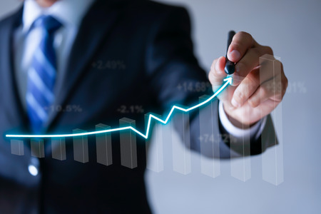 Businessman presenting a sustainable development concept, growth, profit, success chartの写真素材