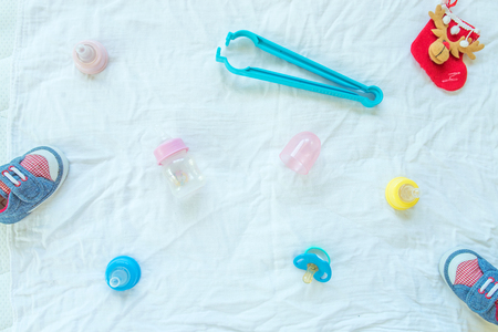 Baby set of item and accessories on white fabric background.の写真素材