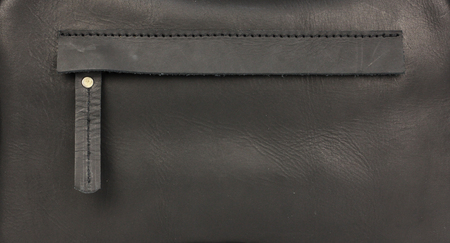 hidden zippered pocket on natural black leather, part of leather bagの写真素材